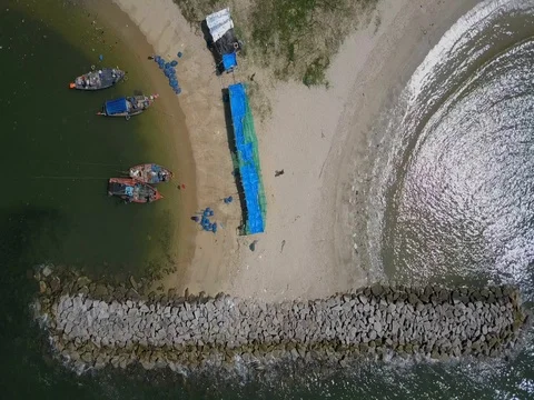 Stone wave breaker into the sea at Map ta phut Industrail Estate, Rayong Stock Footage 77443312