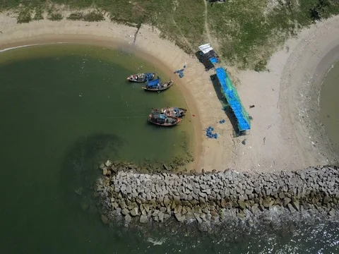 Stone wave breaker into the sea at Map ta phut Industrail Estate, Rayong Stock Footage 77443322