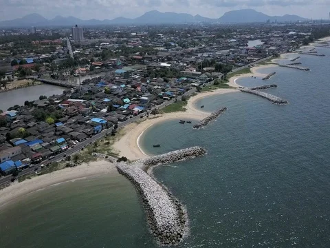 Stone wave breaker into the sea at Map ta phut Industrail Estate, Rayong Stock Footage 77443336
