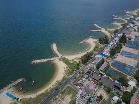 Stone wave breaker into the sea at Map ta phut Industrail Estate, Rayong Stock Footage 77443433