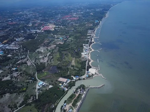 Stone wave breaker into the sea at Map ta phut Industrail Estate, Rayong Stock Footage 77443436