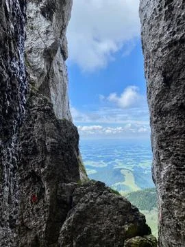 Stone window with mountain view over valley, blue sky, Bavaria, Germany Stock Photos