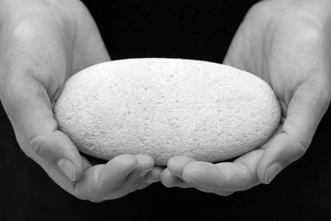 Stone in woman's hands (Black and White Image) Stock Photos