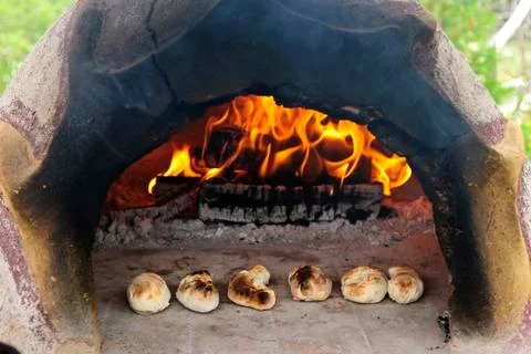 Stone wood oven baking bread Stock Photos
