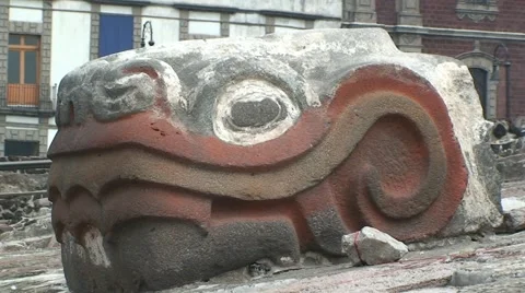 Stone Znake Head of Aztec God Quetzalcoatl in Tenochtitlan Ruins, Mexico City Stock Footage 47929015