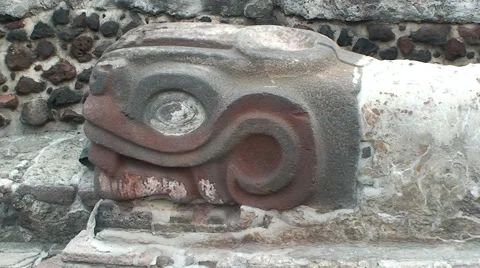 Stone Znake Head of Aztec God Quetzalcoatl in Tenochtitlan Ruins, Mexico City Stock Footage