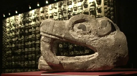 Stone Znake Head of Aztec God Quetzalcoatl on a background of Tzompantli in Teno Stock Footage