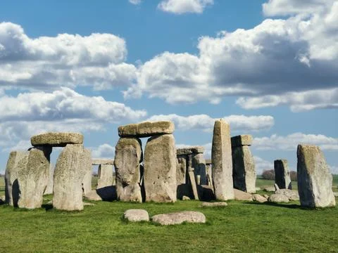 Stonehenge in Bright Day with Dramatic Clouds Behind It Stock Photos