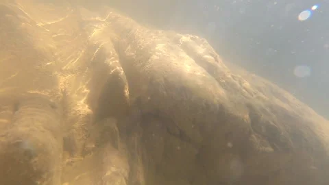 Stones at bottom of mountain river and air bubbles of fast and strong stream Stock Footage 141487155