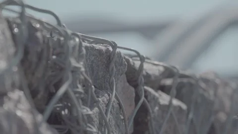 Stones in a chain-link mesh, wall of stones Stock Footage 278397571