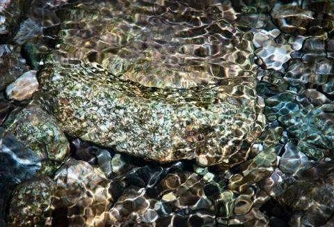 Stones in clear streams Stock Photos