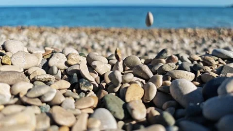 Stones falling on the beach Stock Footage 277723239