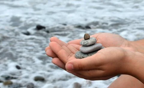 Stones in hands Stock Photos