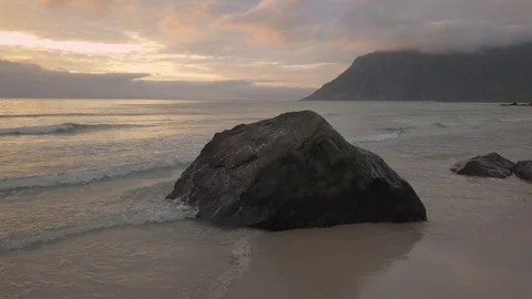 Stones lying on the beach in the evening before sunset Stock Footage 93563234