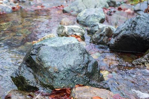 Stones in a mountain stream Stock Photos