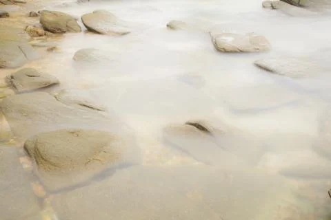 Stones in the river. Stock Photos