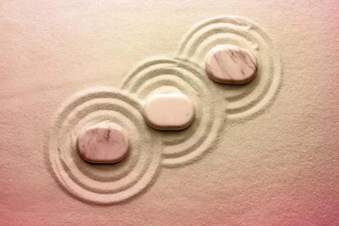 Stones on sand with pattern, flat lay. Zen, meditation, harmony Stockfoto's