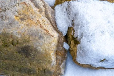 Stones in the snow. Stock Photos