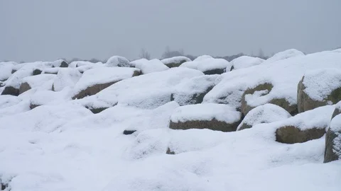 Stones with snow on them Stock Footage 86862115