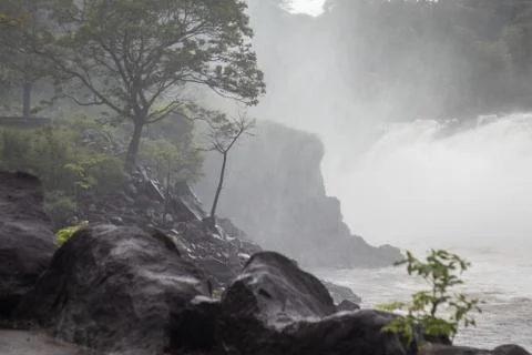 Stones sprayed with moisture from a waterfall Stock Photos