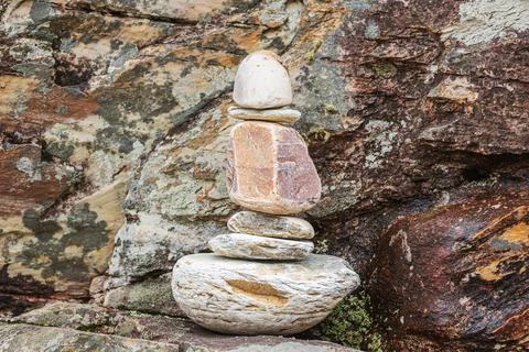 Stones stacked in a phallic shape. Stock Photos
