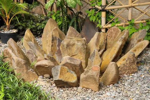 Stones stacked in the shape of a flower. Stack tower stone zen art folded blu Stock Photos