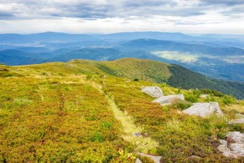 Stones in valley on top of mountain range Stock Photos