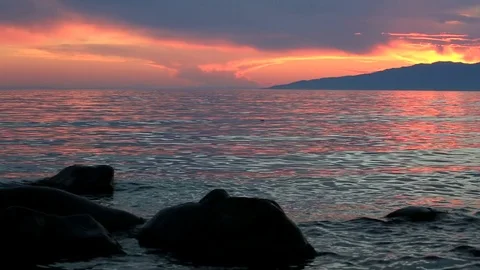 Stones in water on sunset background Stock Footage 78151049