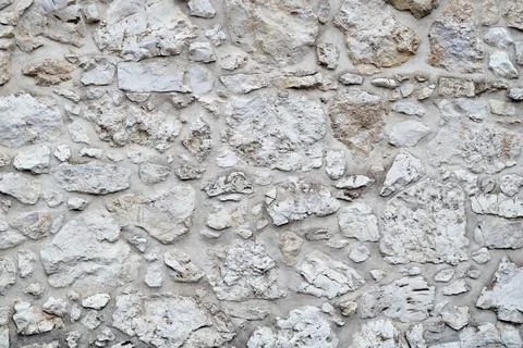 Stonework background. White stone wall. Stock Photos