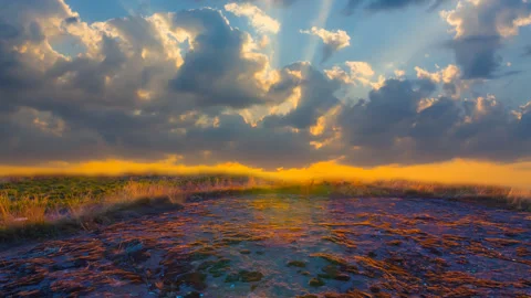 Stony fields at the dramatic sunset time lapse scene Stock Footage 253432957
