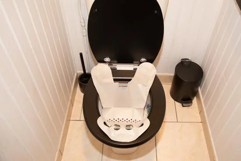 Stool collection facilitator device paper sleeve for the toilet seat used f.. Stock Photos