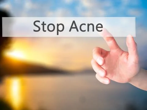 Stop Acne - Hand pressing a button on blurred background concept . Business,  Stock Photos