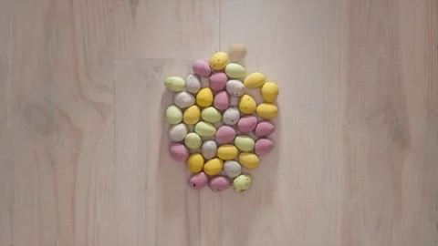 Stop animation of mini chocolate eggs forming a large egg shape Stock Footage 270801953