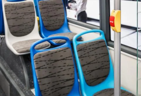 Stop button modern and comfortable interior of the city bus Stock Photos
