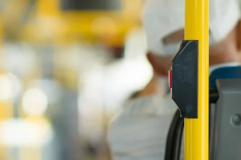 Stop button on yellow holder in modern bus Photos