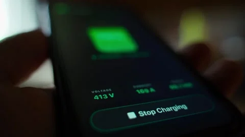 Stop charging button in mobile app for electric vehicle charging Stock Footage 340388441