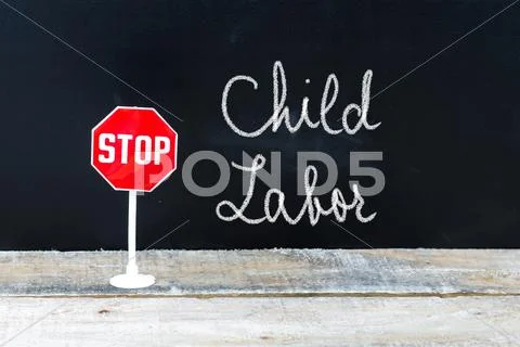 STOP CHILD LABOR message written on chalkboard Stock Photos