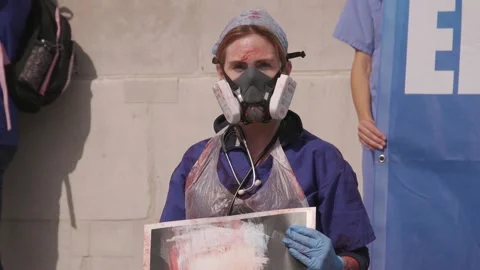 ‘Stop clapping, start paying’: NHS workers demand better wages Stock Footage 148551524