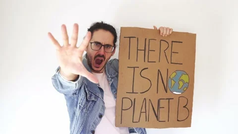 Stop climate change concept. Gen Z demonstrator with glasses waving hand Stock Footage 165660533