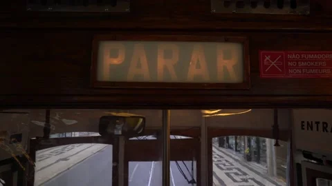 Stop command and sign in Vintage Yellow Tram In The Center Of Lisbon, Portuga Stock-Footage 186965083