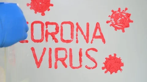 Stop coronavirus concept. hand in blue rubber glove washes glass from red paint 库存影片 128807697