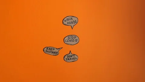 Stop covid 19 measures written on the cartoon bubbles on the orange background. Stock Footage 129804918