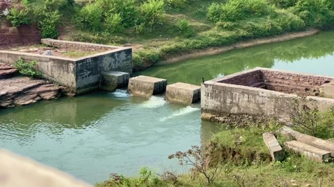 Stop Dam on a River Channel with Green Surroundings Stock Footage 320168080