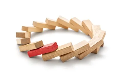 Stop the destructive processes -The red wooden block triggered a domino effec Stock Photos
