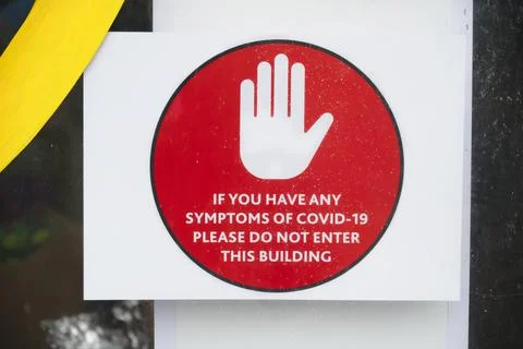 Stop do not enter if have covid-19 symptoms sign Stock Photos