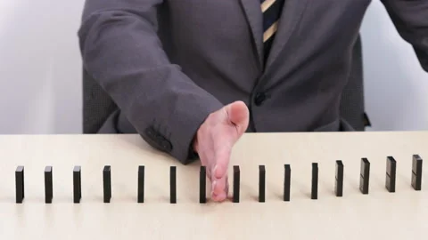 Stop dominos from falling 库存影片 151923297