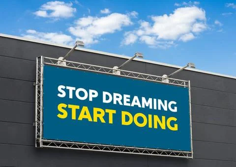 Stop dreaming start doing written on a billboard Stop dreaming start doing... Stock Photos