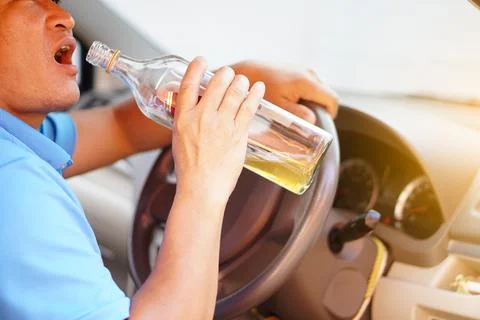 Stop driving while drinking alcohol or whiskey campaign Stock Photos