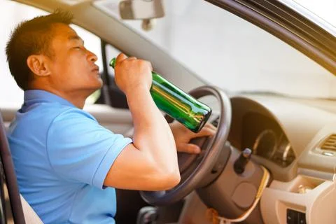 Stop driving while drinking alcohol or whiskey campaign Stock Photos