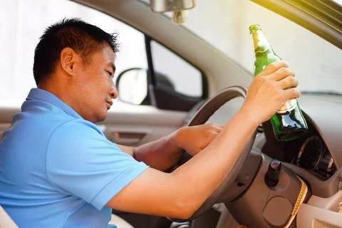 Stop driving while drinking alcohol or whiskey campaign Stock Photos